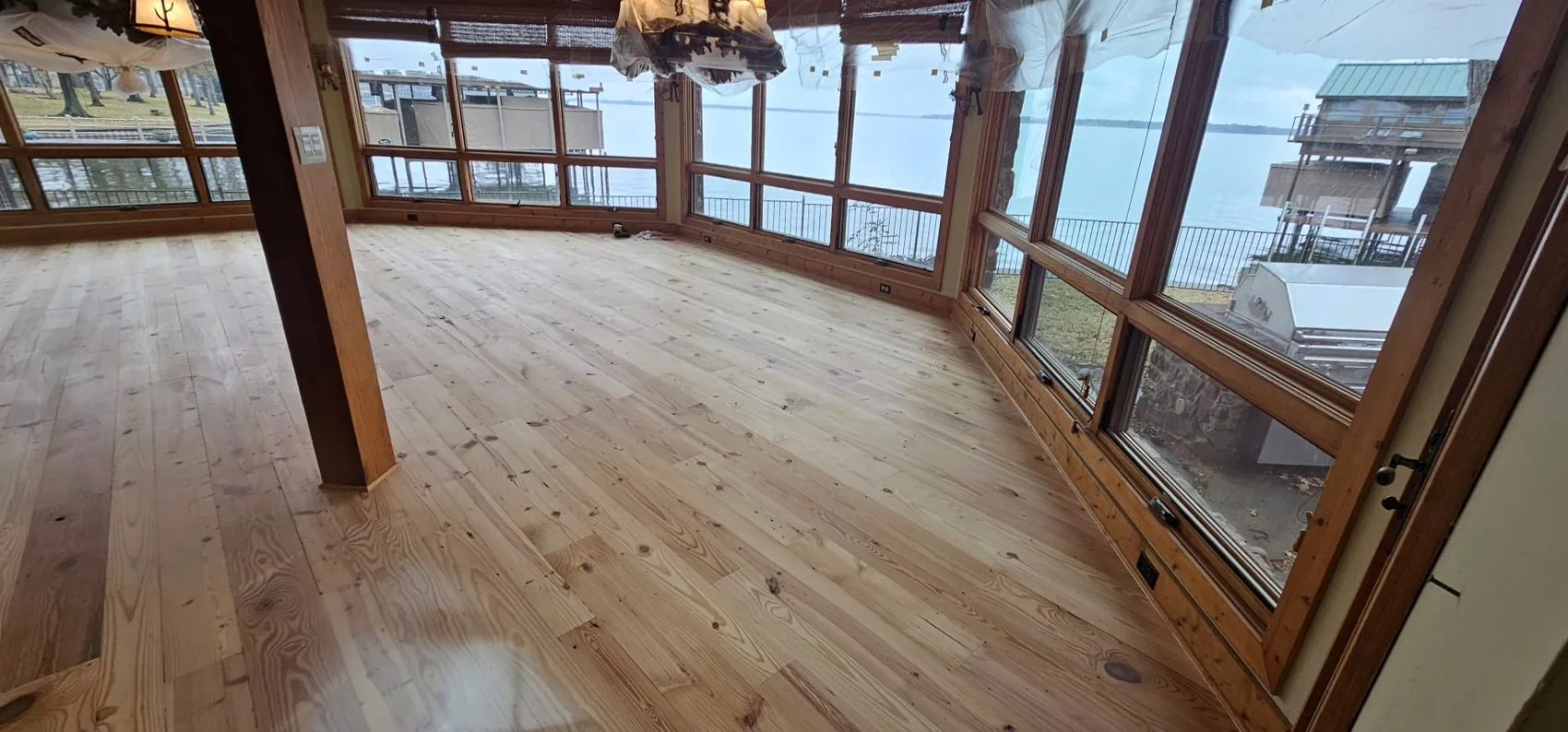 Completed natural hardwood floors in a lake house